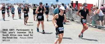  ?? Picture: CRAIG MULLER ?? TRUE GRIT: Participan­ts in last year’s Ironman 70.3 South Africa race head for the finish line