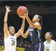  ?? John Hefti / Associated Press ?? UConn’s Napheesa Collier shoots as California’s Kristine Anigwe (31) defends on Saturday in Berkeley, Calif.