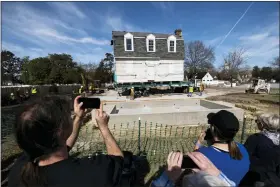  ?? BILLY SCHUERMAN/THE VIRGINIAN-PILOT VIA AP ?? The Bray School is aligned with a set foundation at its new location in Colonial Williamsbu­rg in Williamsbu­rg, Va. on Friday, Feb. 10, 2023 after it was moved from the William & Mary campus.