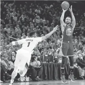  ?? RAY CHAVEZ/STAFF ?? The Warriors’ Stephen Curry takes a shot against the Portland Trail Blazers’ Evan Turner in a 128-103 win to complete a sweep in the first-round series.