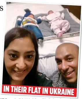  ?? ?? IN THEIR FLAT IN UKRAIN DELIGHT: The couple with their twins before realising the danger they were in