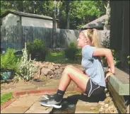  ?? (Arkansas Democrat-Gazette/Celia Storey) ?? Meredith Pinkston does Porch Dips in the pleasant setting of her backyard.