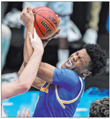  ?? Michael Conroy The Associated Press ?? UCLA will be without guard Jaylen Clark, right, a key member of their team and one of several Bruins dealing with injuries during March Madness.