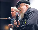  ?? CLYDE MUELLER/THE NEW MEXICAN ?? Jean Cocteau Cinema proprietor George R.R. Martin, right, and Michael Cassutt, a television veteran who wrote for ‘Max Headroom,’ speak Monday prior to a screening of the cult-hit satirical sci-fi series.