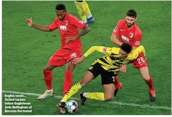  ??  ?? English tussle… Oxford tackles fellow Englishman Jude Bellingham of Borussia Dortmund