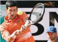  ?? ?? Serbia’s Novak Djokovic returns to Russia’s Aslan Karatsev during their first round match at the ATP Rome Open tennis tournament on Tuesday. Italico in Rome. (AFP)