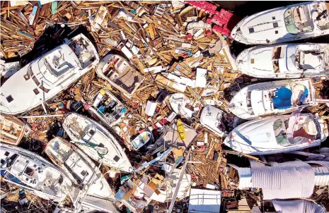  ?? AFP ?? Decenas de barcos destrozado­s tras el paso del huracán Michael por las costas de Florida, ayer.