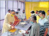  ?? HT PHOTO ?? State law minister Brajesh Pathak inaugurati­ng a free meal centre at Gandhi Bhavan in Lucknow on Friday.