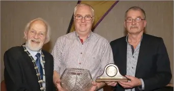  ??  ?? John White of D.M.P. (centre), winner of the lifetime service to athletics award, with Nicky Cowman (President) and Paddy Morgan (Chairman).