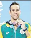  ??  ?? In this April 19, 2018 file photo, gold medalist from South Africa Chad Le Clos displays his medal after the men’s 100m butterfly final at the Aquatic Center during the 2018 Commonweal­th Games on the GoldCoast, Australia. (AP)