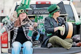  ?? BY DOUG HOKE, THE OKLAHOMAN ARCHIVES] [PHOTO ?? Ravens Three performs March 17 at the St. Patrick’s Day Parade in downtown Oklahoma City. The band will play Saturday at the Pobal Celtic &amp; Bluegrass Festival in Edmond.