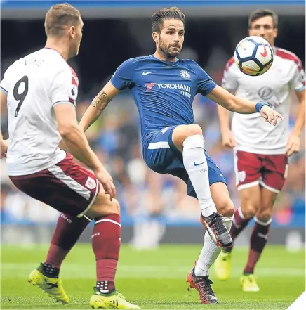  ??  ?? Chelsea’s Cesc Fabregas – soon to be sent off – controls the ball under pressure from Sam Vokes.