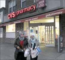  ?? Mark Lennihan/Associated Press ?? Customers leave a CVS Pharmacy Sunday in the Brooklyn borough of New York City.