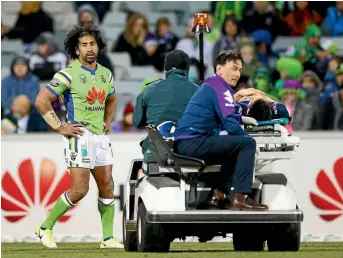  ?? PHOTO: MARK NOLAN/GETTY IMAGES. ?? Canberra backrower Iosia Soliola looks on as Melbourne’s Billy Slater is driven off GIO Stadium.