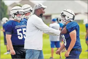  ?? THE OKLAHOMAN] ?? Dillon Best, left, listens to instructio­n from a Christian Heritage coach. The Crusaders' center and nose guard will miss the 2019 season after having back surgery. [NATE BILLINGS/