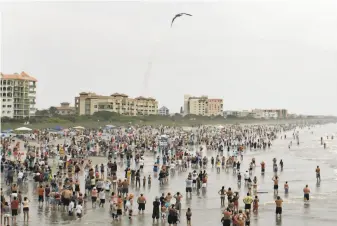  ?? Dave Martin / Associated Press 2011 ?? Thousands gather July 8, 2011, to watch a space shuttle launch. The first astronaut launch from Florida in nine years is set for Wednesday, and NASA is concerned about the virus pandemic.