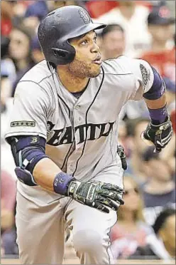  ?? AP ?? Robinson Cano watches his 2-run homer soar out of Fenway Park as Mariners avoid three-game sweep against Red Sox Sunday.