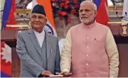  ?? (AFP) ?? Indian Prime Minister Narendra Modi (right) and Prime Minister of Nepal K P Sharma Oli, in New Delhi on Saturday