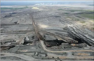  ?? BRUCE EDWARDS POSTMEDIA NEWS ?? Thursday’s federal budget puts Finance Minister Jim Flaherty on a collision course with environmen­tal groups that are waging an intense battle against the oilsands sector as well as new official opposition leader Thomas Mulcair.