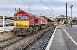  ?? ONTRACKIMA­GES. ?? DB Cargo UK 66055 Alain Thauvette stands at York’s Platform 6 on December 25 2019, working within a possession. Network Rail renewed 306 metres of track and ballast, with DBC contracted to deliver and remove materials.