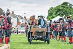  ??  ?? SENSE OF OCCASION Celebratio­ns on the green at Datchet, above; the Vauxhall 6HP’s rudimentar­y single-cylinder petrol engine, top