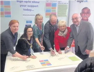  ?? Guests sign up to support Age UK Lancashire’s Charter for Later Life ??