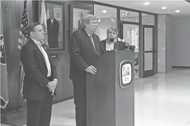  ?? COMMERCIAL APPEAL ?? Mayor Jim Strickland discusses plans for a trash service overhaul on Friday, July 20. Flanking him are city public works director Robert Knecht, left, and City Council member Frank Colvett. DANIEL CONNOLLY / THE