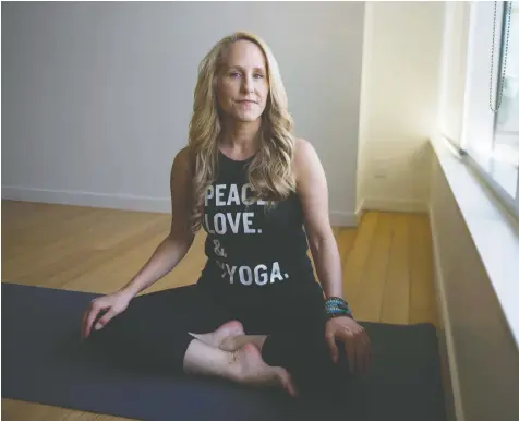  ?? JASON PAYNE/POSTMEDIA ?? Carey Dillen, president of Vancouver-based YYoga, says she will meet whatever requiremen­ts the B.C. government and health authoritie­s establish in the coming weeks that will allow her to reopen her business.