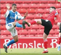  ??  ?? FOOT IN: Blues’ Yan Valery battles with Tykes’ Alex Mowatt