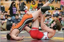  ?? ?? NFA’s Jaiden James, right, and Montville´s Luke Chapman battle during the 120-pound final in the 2022 ECC wrestling tournament at Killingly High School. James went on to win the title and his back to defend his championsh­ip this season.