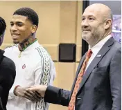  ?? JOSE A. IGLESIAS jiglesias@elnuevoher­ald.com ?? Rapper NLE Choppa, whose real name is Bryson Potts, left, shakes hands with his attorney, Brad Cohen, at the Broward County Courthouse in Fort Lauderdale on Friday.