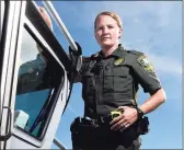  ?? Tyler Sizemore / Hearst Connecticu­t Media file photo ?? EnCon police officer Alexandra Blackwell on her boat at state Department of Energy and Environmen­tal Protection headquarte­rs in Old Lyme.