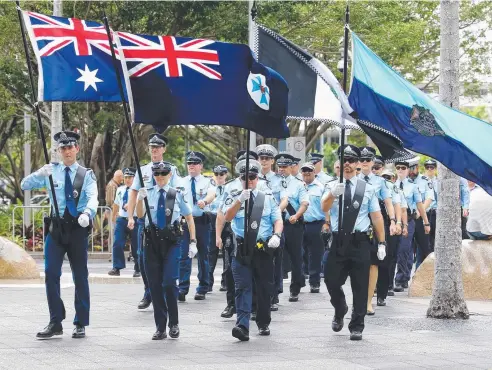  ?? Picture: JOSH WONING ?? PAYING TRIBUTE: The parade moves through Cairns on Police Remembranc­e Day yesterday.
