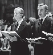  ??  ?? TOOK THE BLAME: President Jimmy Carter, left, and Vice President Walter Mondale sing while holding hymnals during prayers for the Iran hostages at the National Cathedral on Nov. 16, 1979.