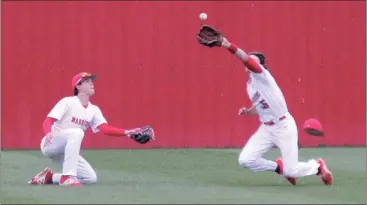  ??  ?? Jacob Flanagan watches as Brice Donnahoo dives to make a catch during last Friday’s home game against Calhoun. Donnahoo made the spectacula­r grab, but the Jackets scored a run in the top of the seventh to win, 2-1. (Catoosa County News photo/Scott...