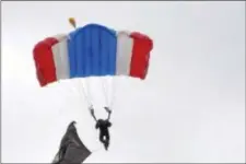  ?? ANNE NEBORAK – DIGITAL FIRST MEDIA ?? Sgt. First Class Ryan O’Rourke parachutes into Rose Tree Park with a POW flag. He is part of the All Veteran Group Skydivers.