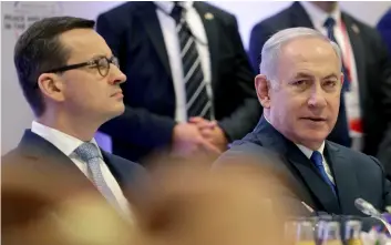  ??  ?? In this Thursday, Feb. 14 photo Poland’s Prime Minister Mateusz Morawiecki (left) and Israeli Prime Minister Benjamin Netanyahu (right) attend a meeting in Warsaw, Poland. AP PhoTo/MIchAEl Sohn