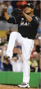  ??  ?? The Marlins’ Edinson Volquez starts the celebratio­n after striking out the side in the ninth inning to complete his no- hitter.
| AP