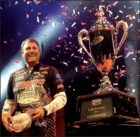  ?? Arkansas Democrat-Gazette/BRYAN HENDRICKS ?? Bryan Thrift of Shelby, N.C., reacts after learning he won the FLW Cup on Sunday at the Bank OZK Arena in Hot Springs. Thrift, the leader after the tournament’s first two days, won his first FLW Cup and $300,000.