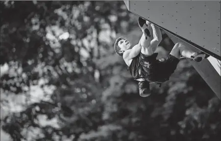  ?? AFP ?? Colin Duffy scales a wall during the men’s lead final at a Climbing IFSC World Cup event in Villars-sur-Ollon, Switzerlan­d on July 3. The American had originally hoped to make his Olympic debut at the 2024 Paris Games, however his natural climbing skills and analytical ability allowed him to push his time frame forward and, at 17, become one of the youngest athletes at Tokyo 2020.