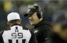  ?? JOHN FROSCHAUER — THE ASSOCIATED PRESS ?? Eagles head coach Doug Pederson, right, talks with an official in the first half Sunday night against the Seahawks in Seattle.