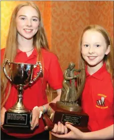  ??  ?? Kayleigh Moran, under-15 singing winner, and Caoimhe Moran, under-15 harp winner.