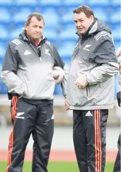  ??  ?? New Zealand All Blacks head coach Steve Hansen (right), assistant head coach Ian Forster watch their players take part in a training session in Auckland in this July 6, 2017 file photo. — AFP photo