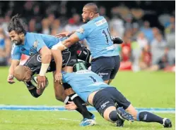  ?? Picture: TEBOGO LETSIE ?? MAN DOWN: JP Pietersen of the Sharks is hit by three Waratahs players, Benn Robinson, No 1, going low, Silatolu Latu, right, and Jacques Potgieter