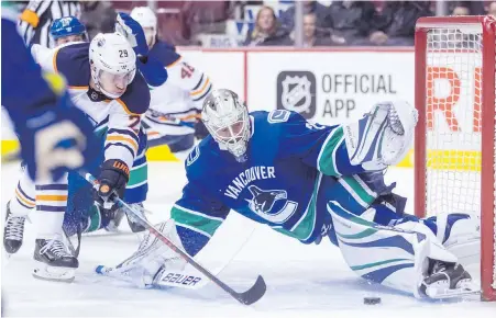  ??  ?? Oilers centre Leon Draisaitl is stopped by Canucks goaltender Jacob Markstrom in Vancouver on Thursday.