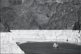  ?? ASSOCIATED PRESS ?? IN THIS OCT. 14, 2015, FILE PHOTO, a riverboat glides through Lake Mead on the Colorado River at Hoover Dam near Boulder City, Nev.