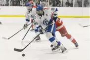  ?? Dave Stewart/Hearst Connecticu­t Media ?? Darien’s Grafton Ely (10) skates with the puck against Greenwich during the FCIAC boys ice hockey semifinals at the Darien Ice House on Wednesday.