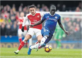  ??  ?? Chelsea’s N’Golo Kante, right, turns away from Arsenal’s Alexis Sanchez.