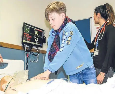  ??  ?? BEAVER Scout Noah Lackenby spent a day learning lifesaving techniques with staff and students at Dundee University after an online video showing his cardiopulm­onary resuscitat­ion (CPR) skills went viral.
Seven-year-old Noah and his best friend Owen...