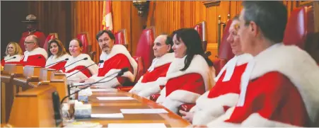  ?? CHRIS HELGREN/REUTERS ?? The justices of the Supreme Court of Canada, shown here in Ottawa in 2019, have ruled that a B.C. father who was untruthful about his income while paying child support must now pay the money retroactiv­ely.